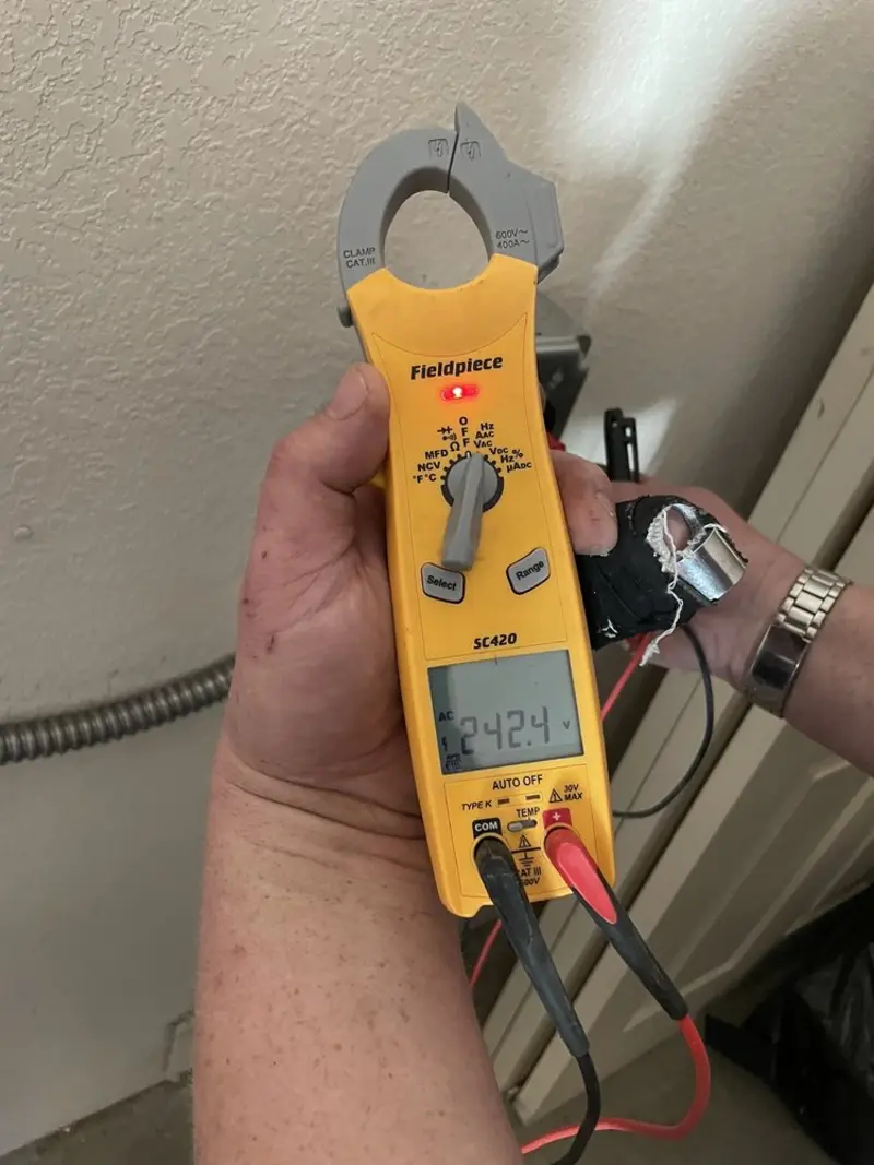 Voltage testing with clamp meter during Ceiling Fan Installation in Manitowoc